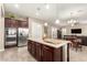Modern kitchen with stainless steel appliances and an oversized island at 19000 E Old Beau Trl, Queen Creek, AZ 85142