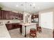 Spacious kitchen with granite countertops, stainless steel appliances, and an island at 19000 E Old Beau Trl, Queen Creek, AZ 85142