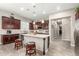 Modern kitchen with center island, stainless steel appliances, and dark cabinets at 19000 E Old Beau Trl, Queen Creek, AZ 85142