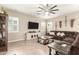 Spacious living room with a sectional sofa and a large TV at 19000 E Old Beau Trl, Queen Creek, AZ 85142