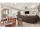 Spacious living room with a sectional sofa and a large TV at 19000 E Old Beau Trl, Queen Creek, AZ 85142