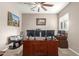 Home office with a large desk and triple monitors at 19000 E Old Beau Trl, Queen Creek, AZ 85142