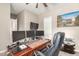 Home office with large desk, triple monitors, and printer at 19000 E Old Beau Trl, Queen Creek, AZ 85142