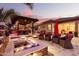 Cozy fire pit area with comfortable seating in a beautifully landscaped backyard at 19000 E Old Beau Trl, Queen Creek, AZ 85142