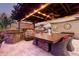 Stunning outdoor kitchen with pergola, grill, and seating at 19000 E Old Beau Trl, Queen Creek, AZ 85142