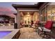 Relaxing covered patio with seating area and outdoor lighting at 19000 E Old Beau Trl, Queen Creek, AZ 85142