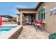 Comfortable outdoor seating area adjacent to the pool and spa at 19000 E Old Beau Trl, Queen Creek, AZ 85142
