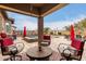 Relaxing covered patio with comfortable seating overlooking the pool at 19000 E Old Beau Trl, Queen Creek, AZ 85142
