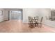 Dining area with glass table and chairs, adjacent to kitchen at 19202 N Camino Del Sol --, Sun City West, AZ 85375