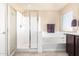 Bright bathroom featuring a shower, bath tub, and tile floors at 2036 E Stacey Rd, Gilbert, AZ 85298