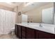 Bathroom featuring a sink vanity with a large mirror and a shower with a polka dot curtain at 2036 E Stacey Rd, Gilbert, AZ 85298