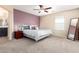 Serene bedroom with soft lighting, plush carpet, and a luxurious queen-sized bed at 2036 E Stacey Rd, Gilbert, AZ 85298