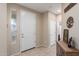 Inviting entryway featuring tile floors, neutral paint, and decorative glass window for added brightness at 2036 E Stacey Rd, Gilbert, AZ 85298