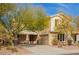 Charming two-story home with stone accents, desert landscaping and a welcoming front porch at 2036 E Stacey Rd, Gilbert, AZ 85298