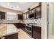 Beautiful kitchen featuring granite countertops, stainless steel appliances, and custom backsplash at 2036 E Stacey Rd, Gilbert, AZ 85298