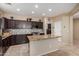 Elegant kitchen with granite counters, stainless steel appliances and center island at 2036 E Stacey Rd, Gilbert, AZ 85298