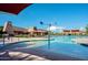 Resort-style community pool with lounge chairs and splash pad at 2036 E Stacey Rd, Gilbert, AZ 85298