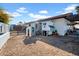 Spacious backyard with play structures, chicken coop, and gravel at 214 E Marconi Ave, Phoenix, AZ 85022