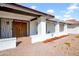 Inviting front entrance with decorative iron gate and covered walkway at 214 E Marconi Ave, Phoenix, AZ 85022