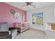 Bedroom with crib, armchair, and large window at 2150 W Alameda Rd # 1313, Phoenix, AZ 85085