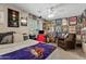 Bedroom with a bed, chair and music posters at 2150 W Alameda Rd # 1313, Phoenix, AZ 85085