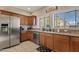 Modern kitchen with stainless steel appliances and granite countertops at 2150 W Alameda Rd # 1313, Phoenix, AZ 85085