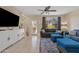 Spacious living area with large TV and ample seating at 2150 W Alameda Rd # 1313, Phoenix, AZ 85085