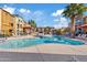 Community pool with lounge chairs and patio umbrellas at 2150 W Alameda Rd # 1313, Phoenix, AZ 85085
