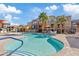 Community pool with lounge chairs and umbrellas at 2150 W Alameda Rd # 1313, Phoenix, AZ 85085