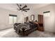 Main bedroom with ceiling fan and large bed at 2181 N 211Th Dr, Buckeye, AZ 85396