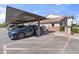 Designated carport parking spot with ample space and well-maintained surroundings at 2201 N Comanche Dr # 1075, Chandler, AZ 85224