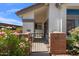 Charming front entrance with a brick gated courtyard and well-maintained landscaping at 2201 N Comanche Dr # 1075, Chandler, AZ 85224