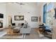 Bright living room featuring a sectional sofa and wood floors at 2201 N Comanche Dr # 1075, Chandler, AZ 85224