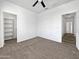 Bedroom with a large closet and neutral walls at 22450 E Duncan St, Queen Creek, AZ 85142