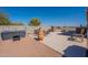 Outdoor patio area with seating, a brick privacy wall, and ample room for gatherings and entertaining at 2363 W Daniel Rd, Queen Creek, AZ 85144