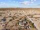 Aerial view of property showcasing expansive desert landscape and multiple structures at 31637 W Grant St, Buckeye, AZ 85326