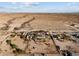 Aerial view showing a house with solar panels and surrounding desert landscape at 31637 W Grant St, Buckeye, AZ 85326