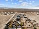 Aerial view showcasing a house, desert landscape, and surrounding area at 31637 W Grant St, Buckeye, AZ 85326