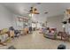 Bright living room featuring tile floors and a ceiling fan at 31637 W Grant St, Buckeye, AZ 85326