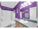 Bathroom boasts a purple color scheme, a shower/tub combo, and updated vanity at 3301 S Goldfield Rd # 1015, Apache Junction, AZ 85119
