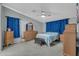 Spacious bedroom with ceiling fan and wood furniture at 3301 S Goldfield Rd # 1015, Apache Junction, AZ 85119