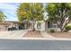Tan colored manufactured home with carport and golf cart at 3301 S Goldfield Rd # 1015, Apache Junction, AZ 85119