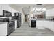 Modern kitchen with white cabinets and black appliances at 3301 S Goldfield Rd # 1015, Apache Junction, AZ 85119