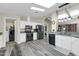 Updated kitchen with white cabinets and black appliances at 3301 S Goldfield Rd # 1015, Apache Junction, AZ 85119