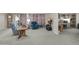 Spacious living room with comfy seating and home office at 3301 S Goldfield Rd # 1015, Apache Junction, AZ 85119