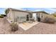 Private backyard patio with seating area and gravel landscaping at 3301 S Goldfield Rd # 1015, Apache Junction, AZ 85119