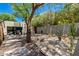 Charming backyard with patio, outdoor seating, desert landscaping and mature shade trees at 3601 N 55Th Pl, Phoenix, AZ 85018