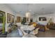 Bright dining area with modern globe light fixture and patio view at 3601 N 55Th Pl, Phoenix, AZ 85018