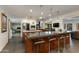 Open kitchen layout with bar seating and stainless steel appliances at 3601 N 55Th Pl, Phoenix, AZ 85018