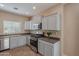 Modern kitchen with stainless steel appliances and ample cabinetry at 3647 W Thalia Ct, Phoenix, AZ 85086